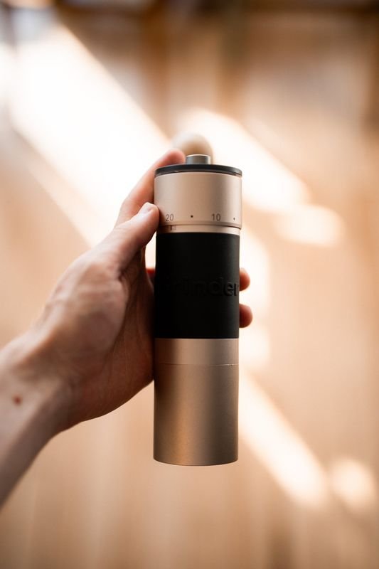 A hand holding the K6 up to the light, its 0 to 20 dial showing