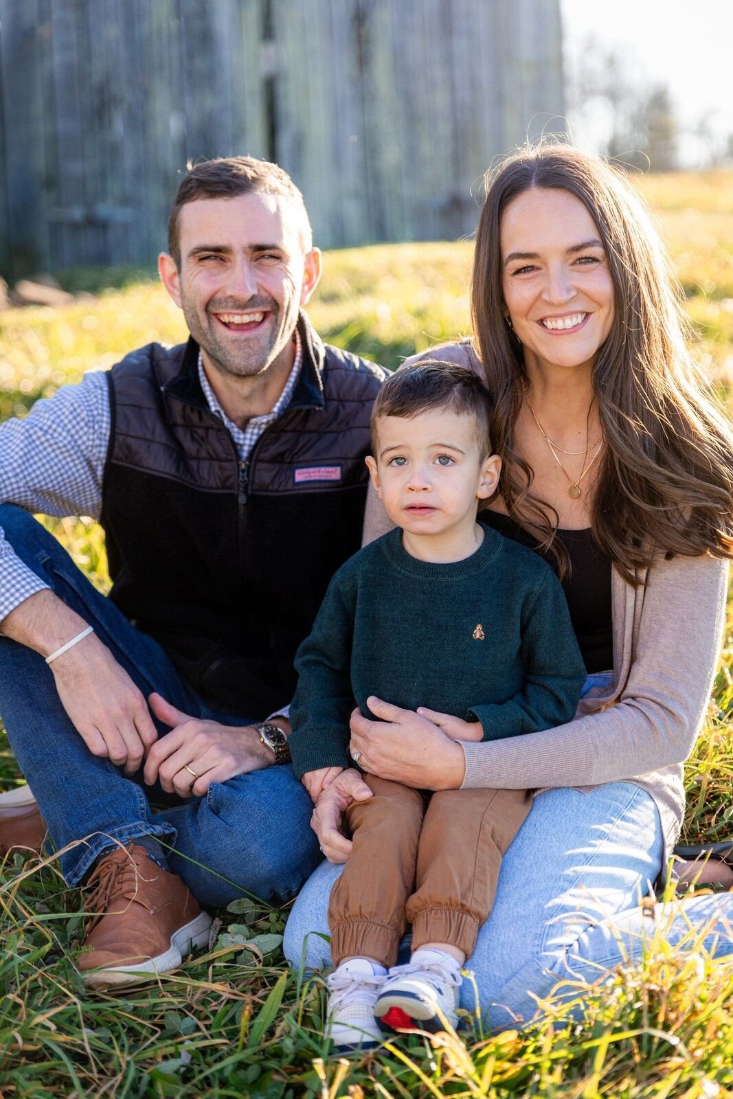 A family sitting together in the grass